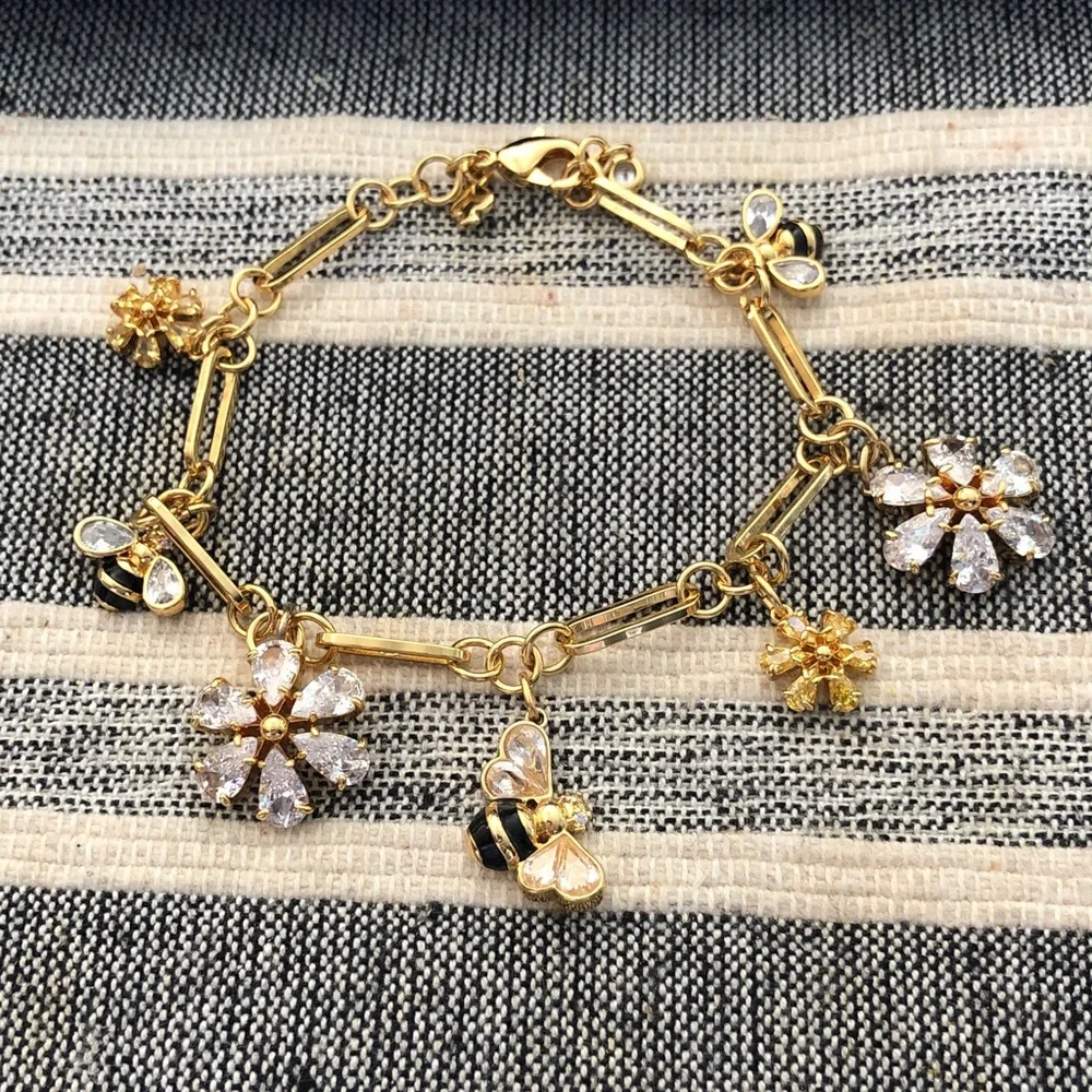 Authentic kate spade New with tag. Gold-Tone Crystal Flower & Bee Charm Bracelet